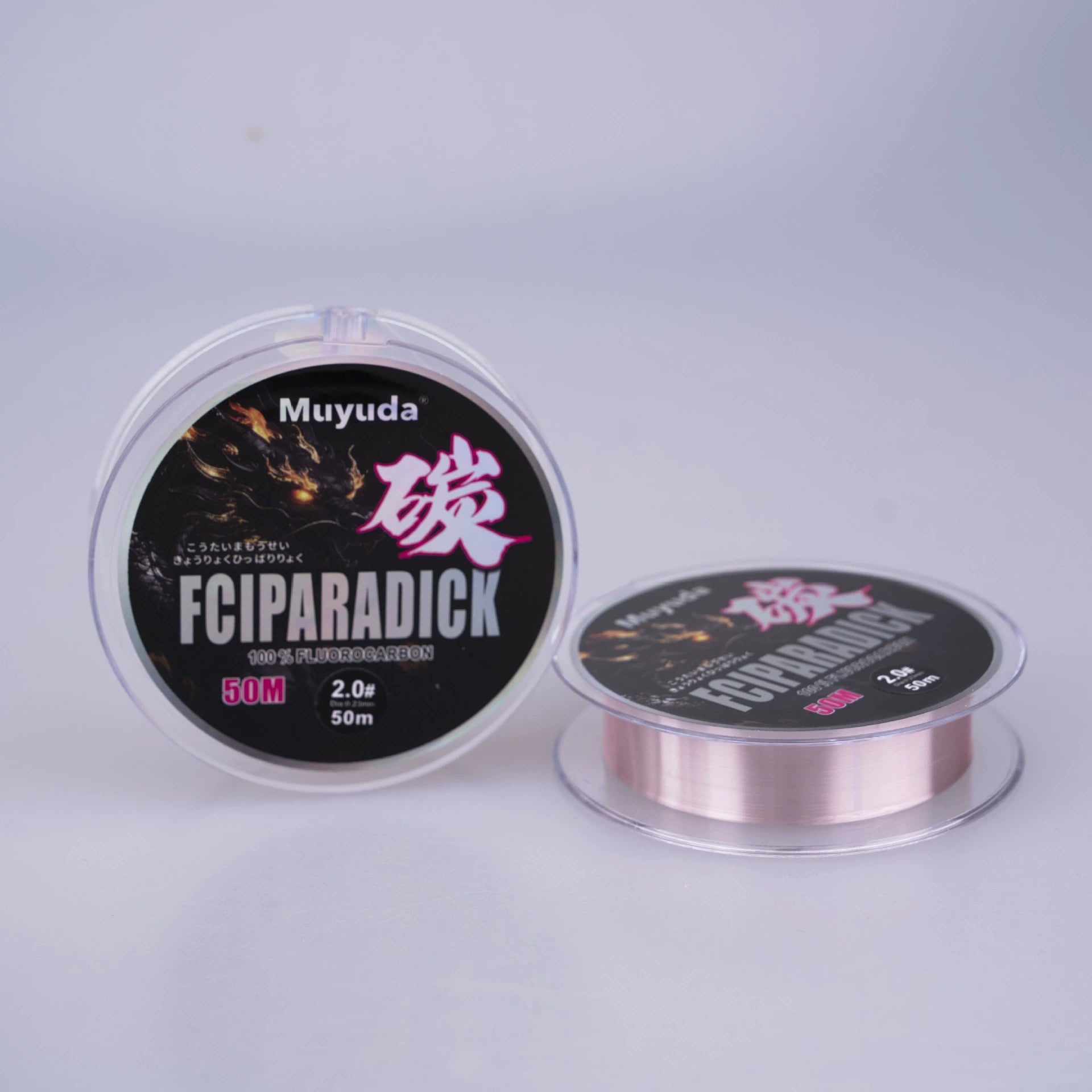 Pink fluorocarbon fishing leader line spool beside black FCIPARADICK box
