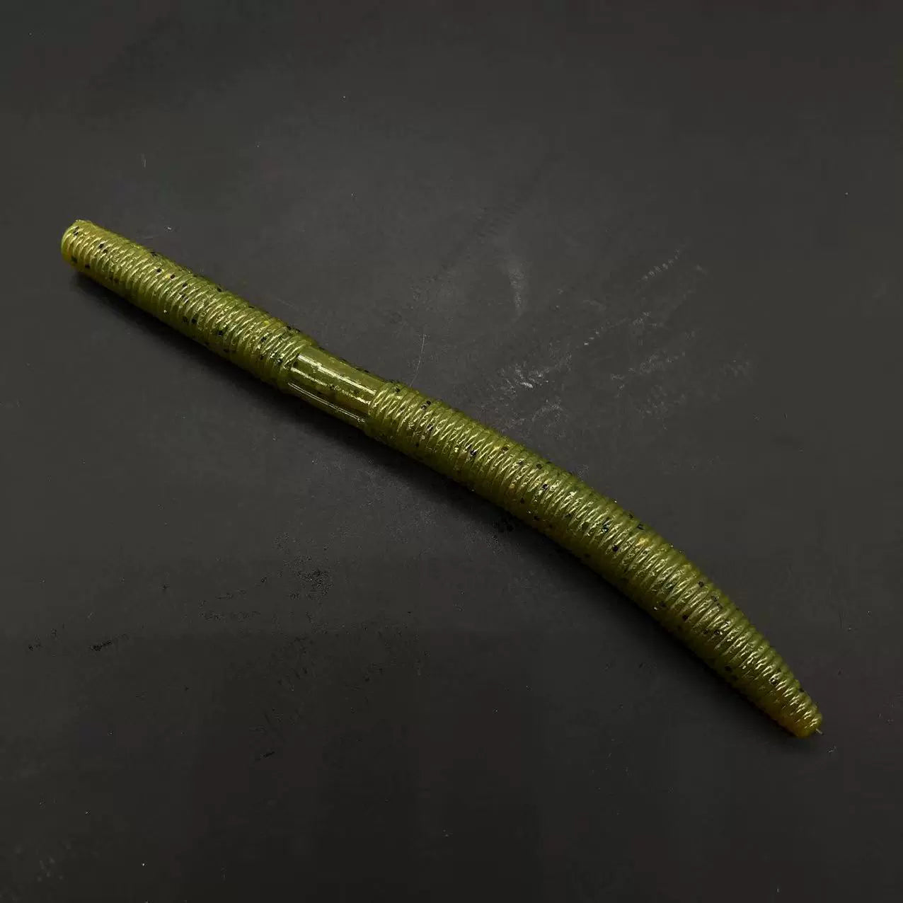 Soft plastic stick bait worm, olive green with glitter speckles