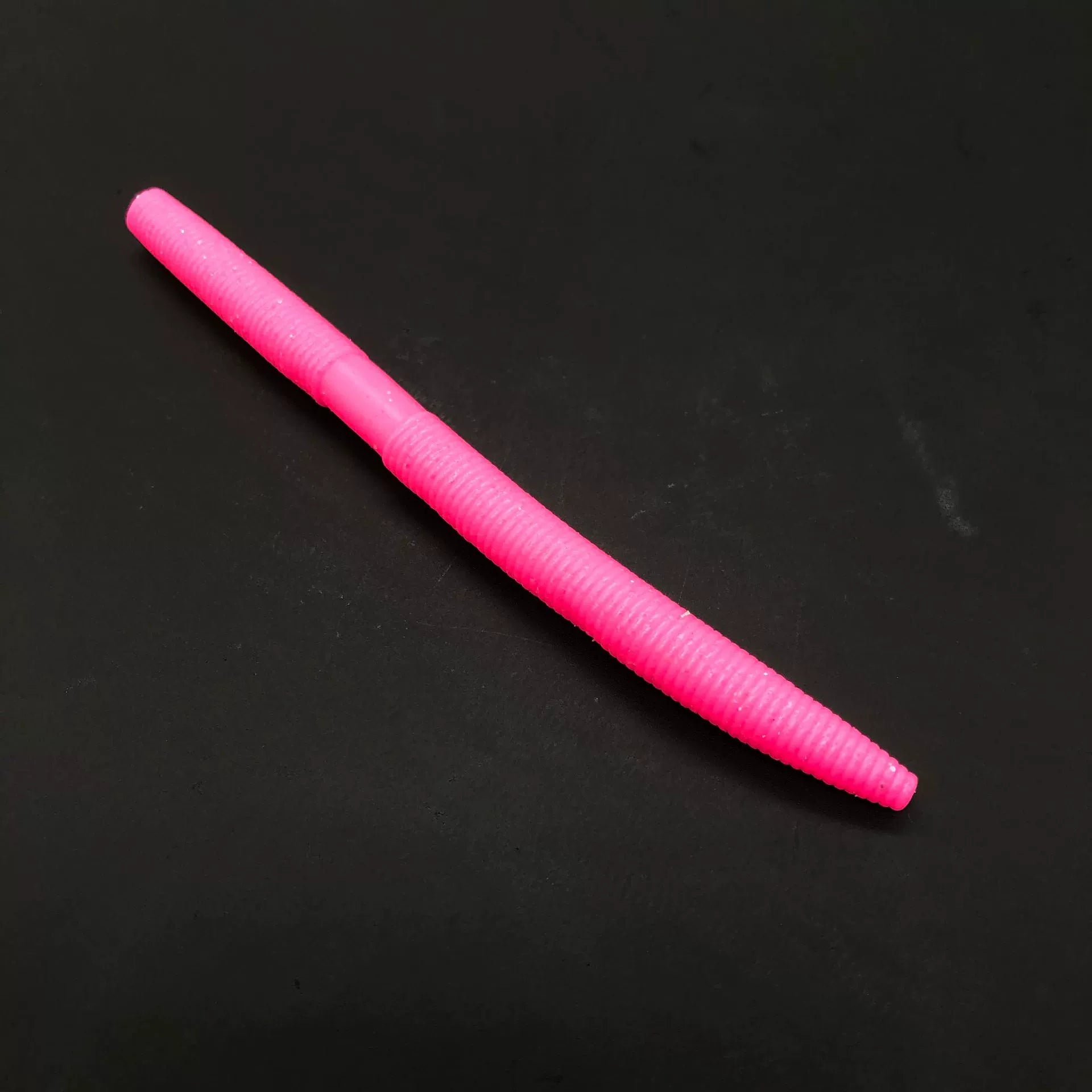 Pink soft plastic stick bait worm, 5 inch length