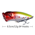 Red and silver topwater popper lure with treble hooks, 3D eye and scale pattern