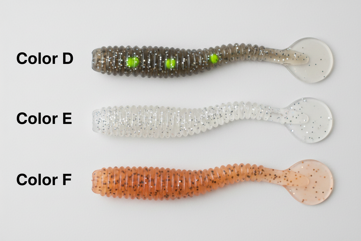 Set of three spiral T-tail soft lures with jig heads: dark olive, white glitter, orange