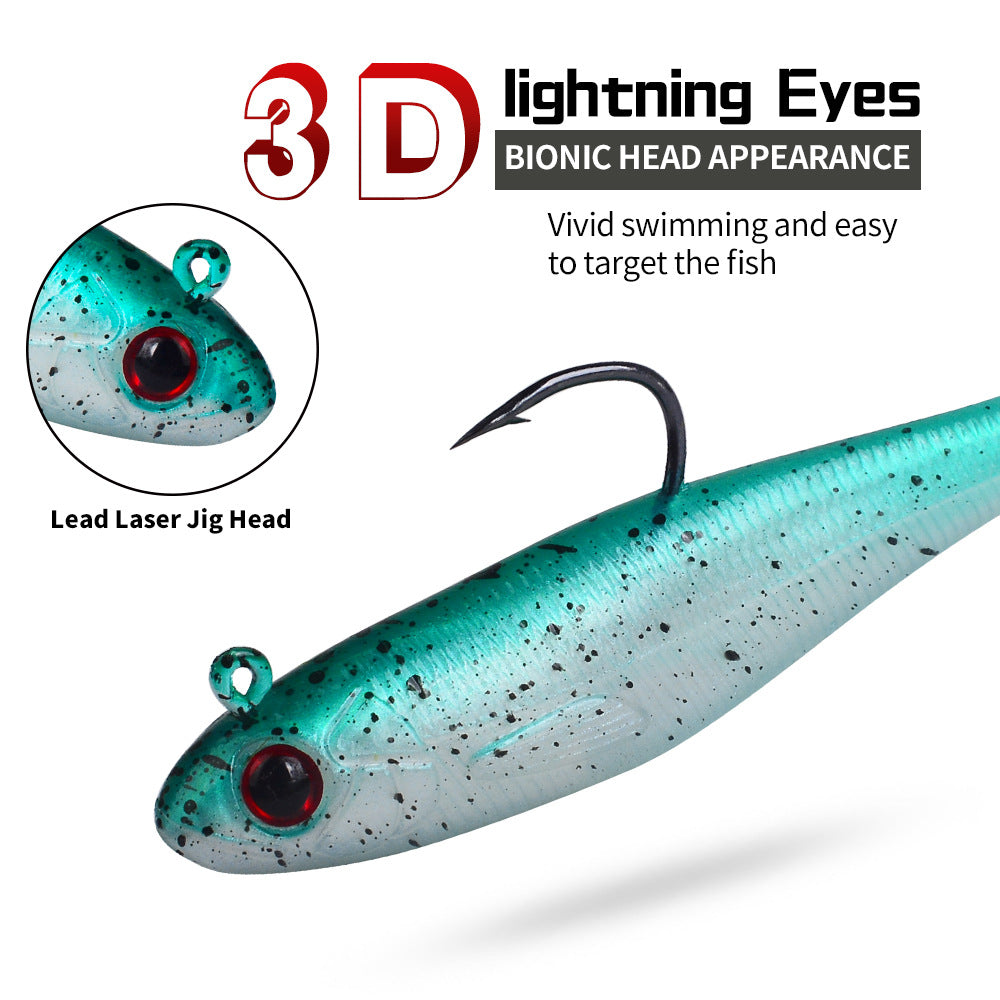 Soft paddle tail swimbait with teal body, red eyes, and laser jig head hook