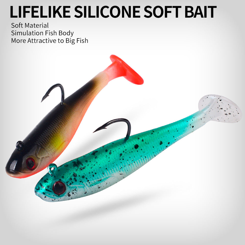Two soft paddle tail swimbait lures with black and teal speckled bodies, hooks