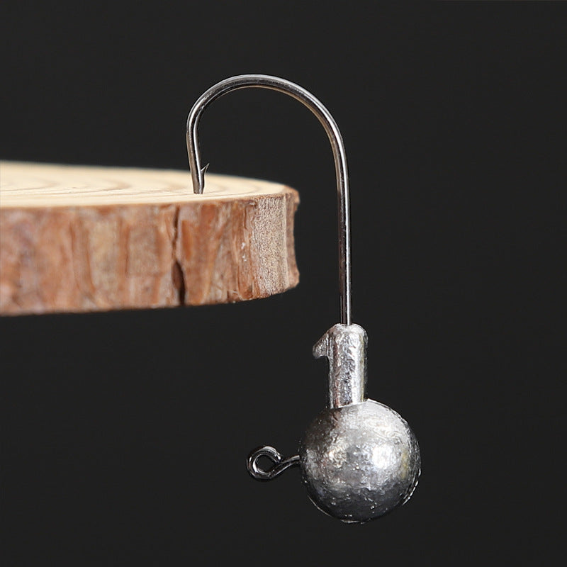 Weedless jig head hook with round lead ball and curved single hook
