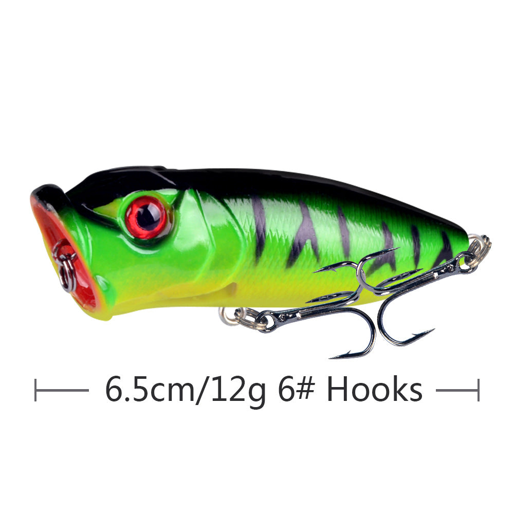 Green and black striped topwater popper lure with treble hooks and 3D eyes