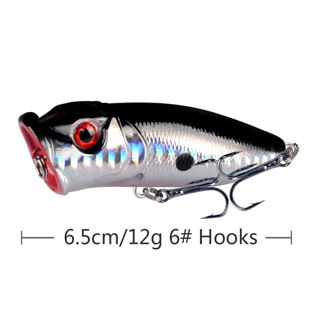 Silver and black topwater popper lure with treble hooks, 3D eye and dot accents
